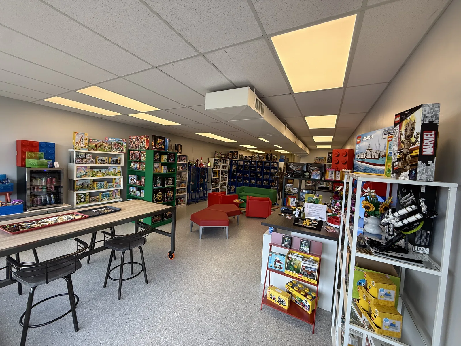 Build tables and shelves of LEGO sets inside Tulsa Bricks